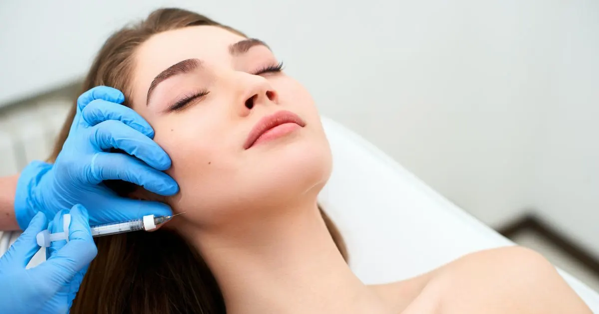 Woman receiving non-surgical anti-aging facial treatment